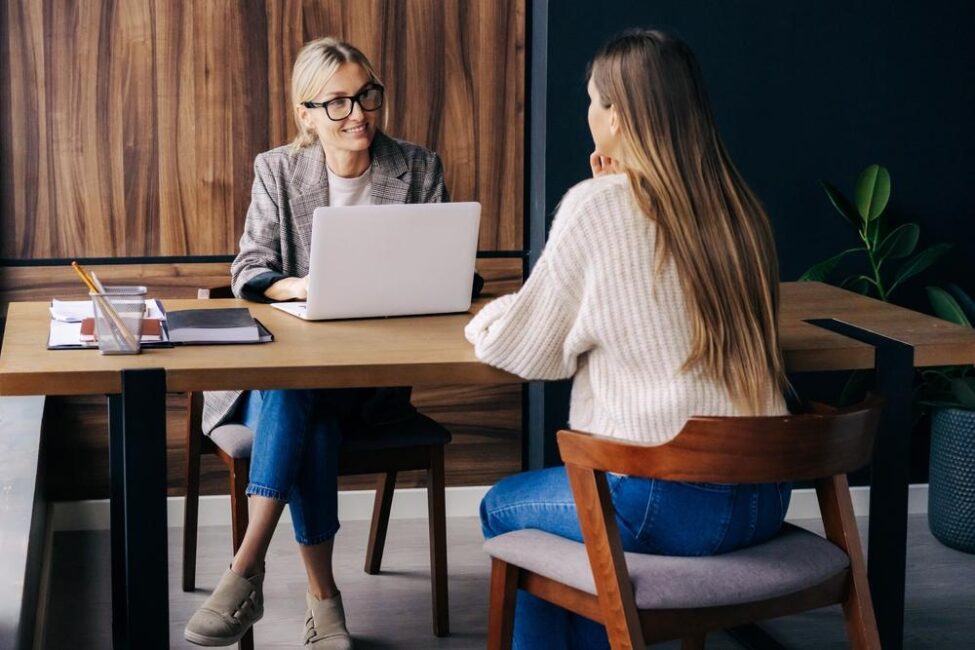 Woman meets with a tax professional to ensure her taxes are filed correctly and on time 