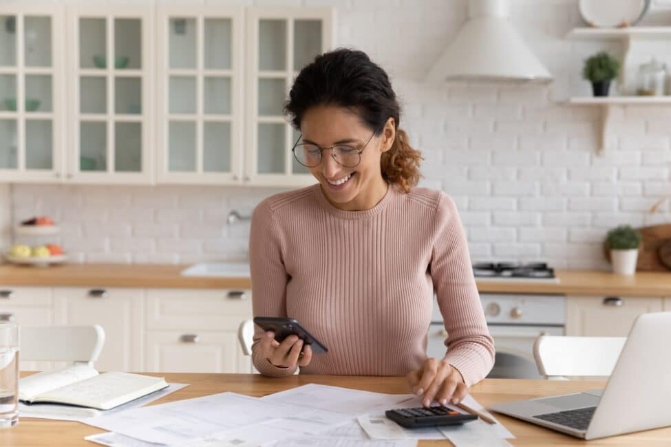 Happy woman finding out she can get a tax refund