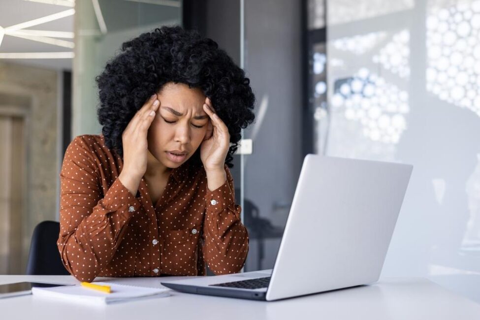 A woman is stressed because she still hasn’t received her W-2