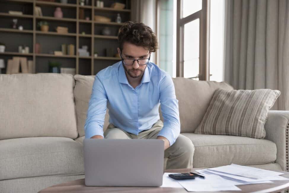 Young man researching alternatives to personal loans for improving credit