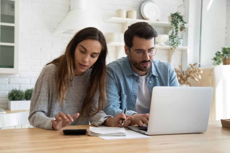 Man and woman trying to figure out how to pay rent