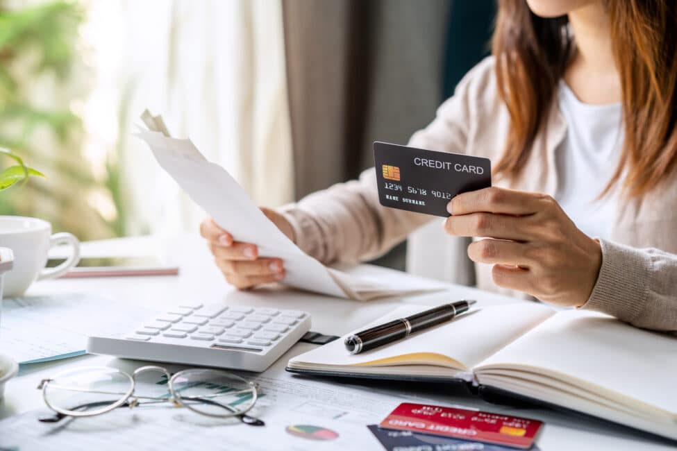 Woman evaluating credit card states to determine if debt consolidation is right for them